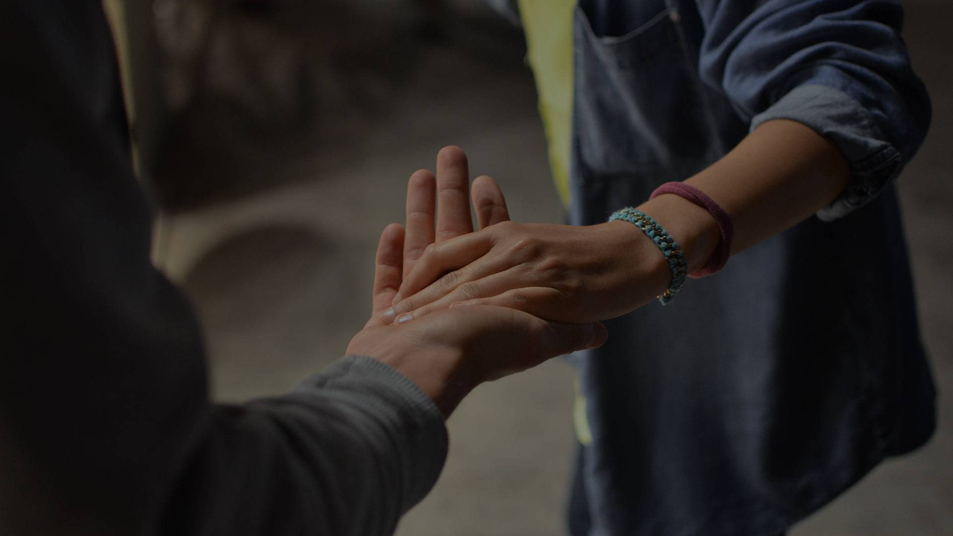 two hand touching in a caring way